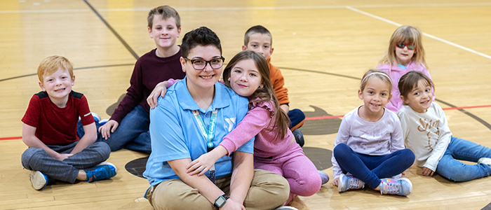 class of 2020 alum bre bianco with children in her before school program