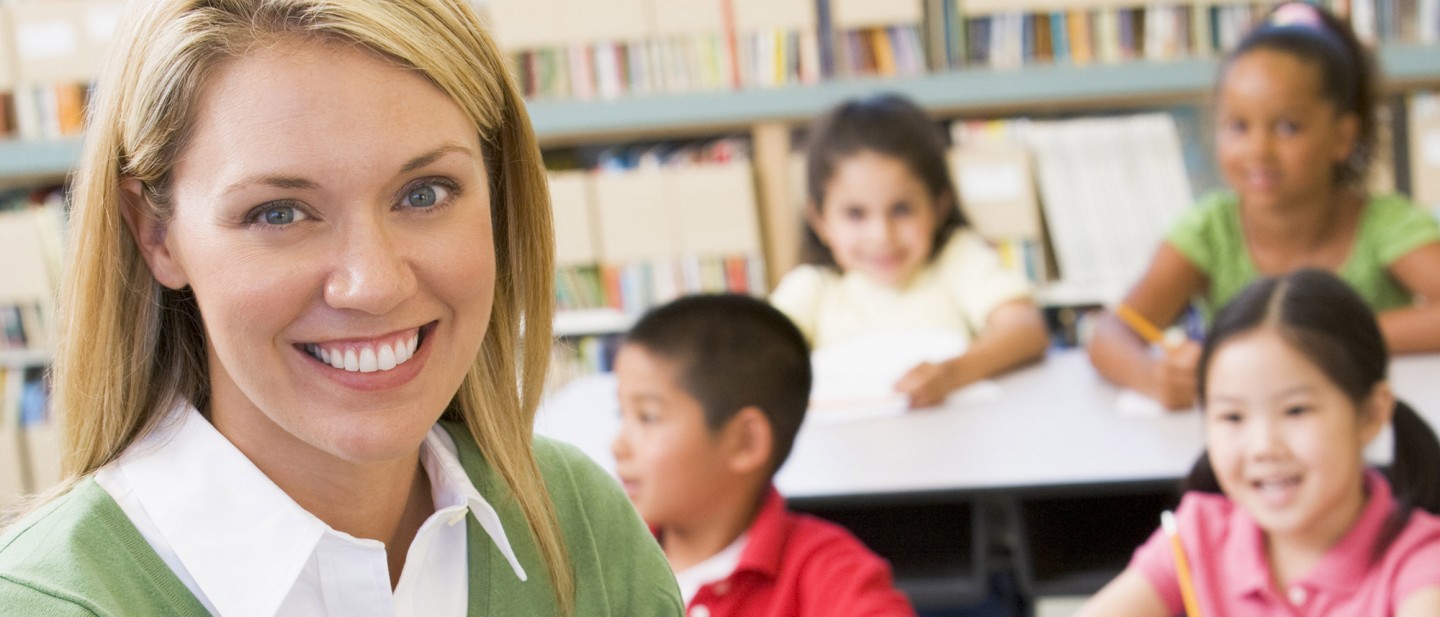 A teacher in a classroom with children