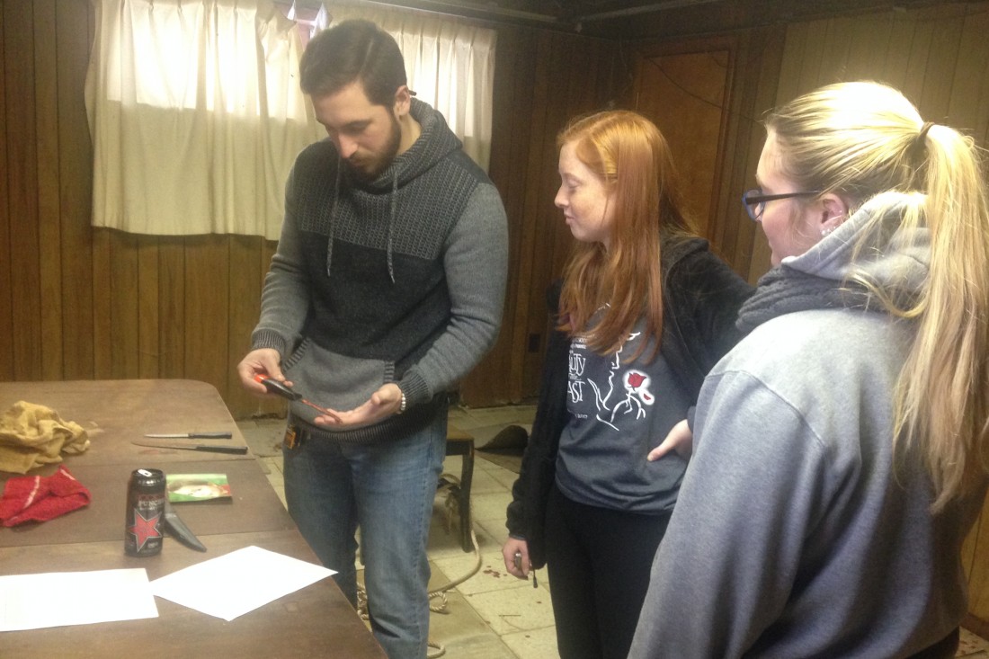 Forensic science students processing visible bloodstain scenes at Seton Hill's crime scene house.