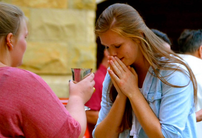 Student receiving sacrament