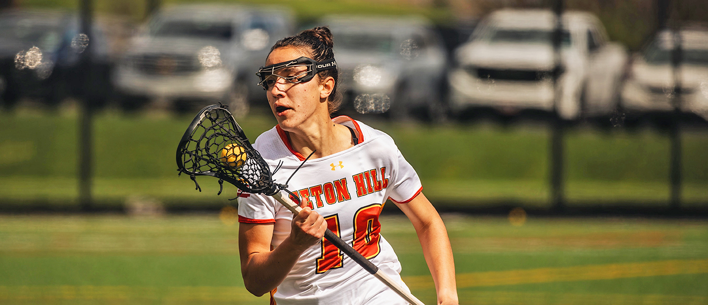 Photo of Amara Forsyth playing lacrosse.